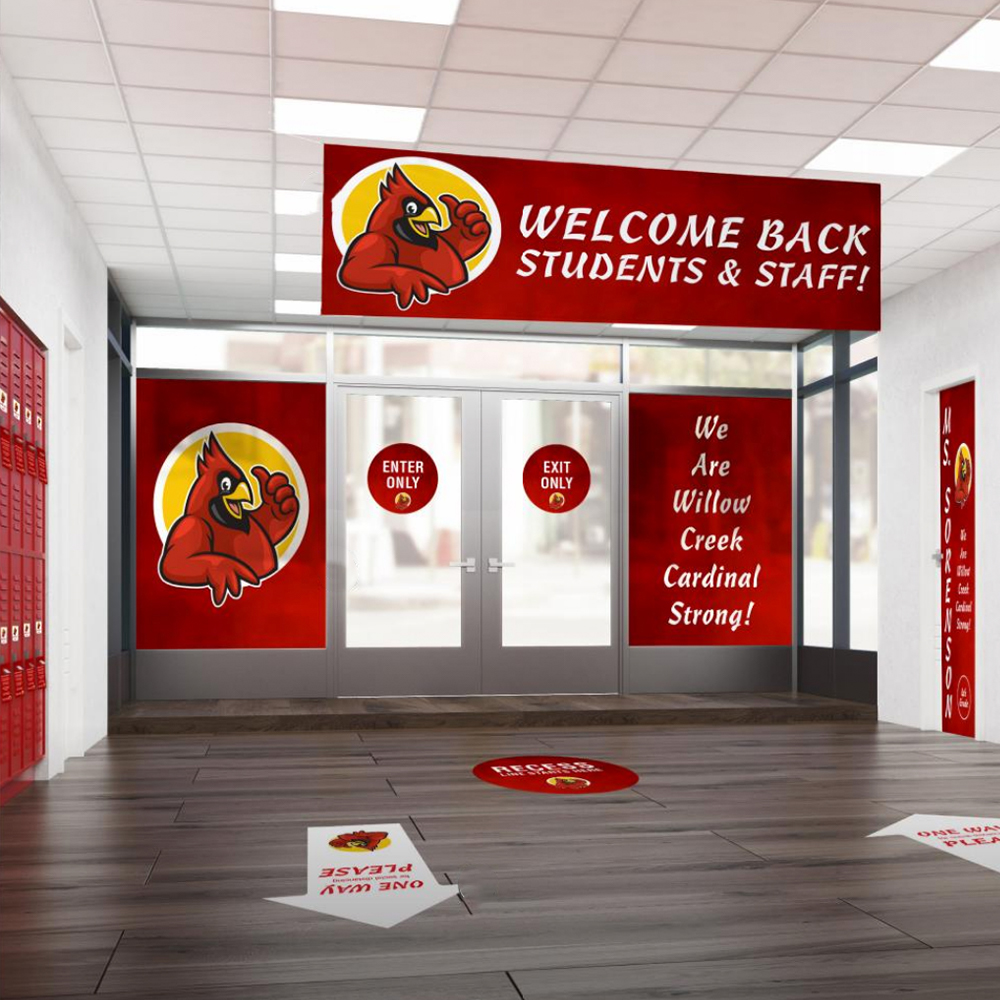 school with welcome back signage, window clings and floor decals