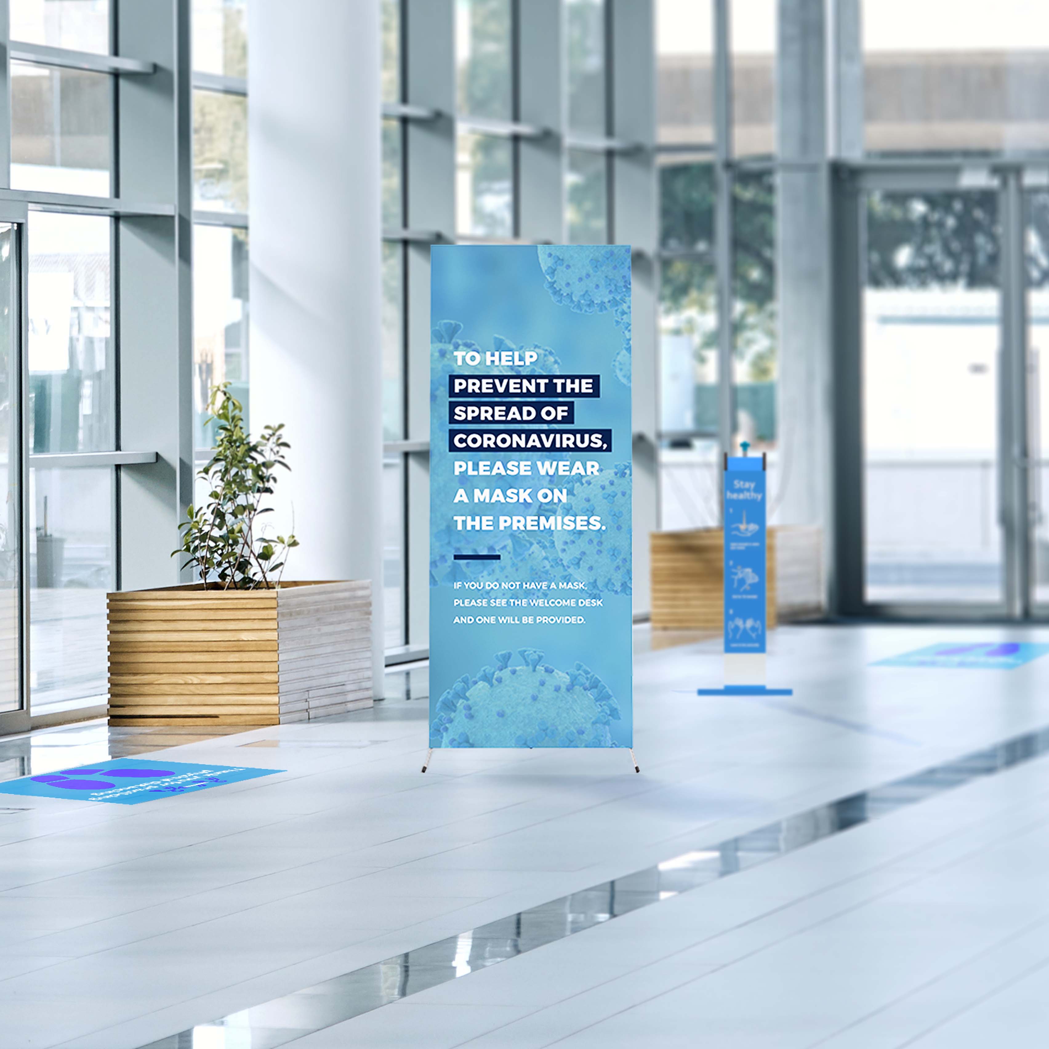 conference center lobby with sanitizer station, floor decal and window clings