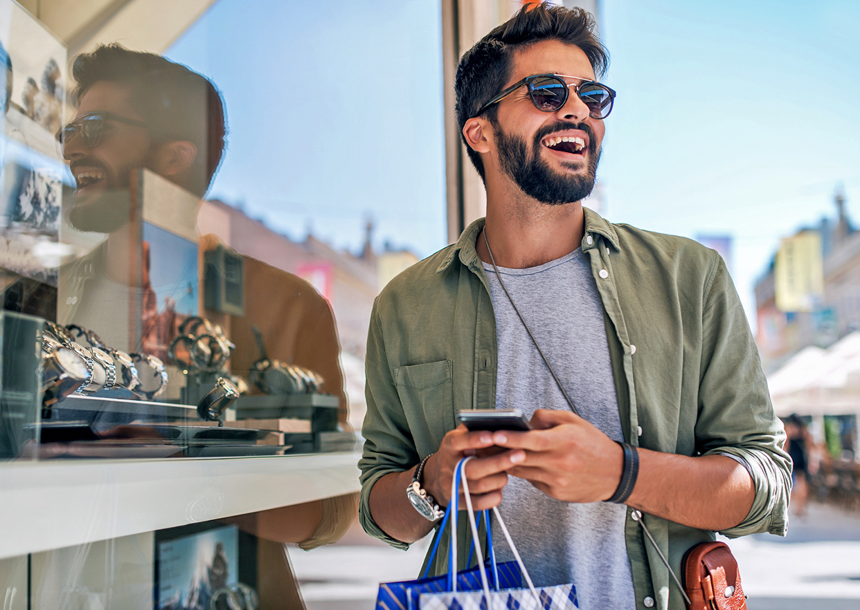 A retail shopper on his phone