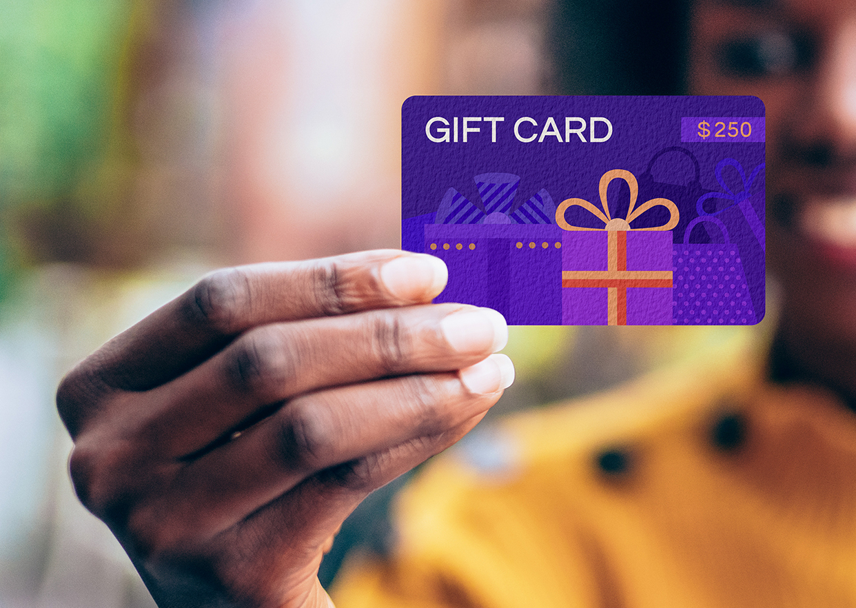 A woman holding a sustainable gift card