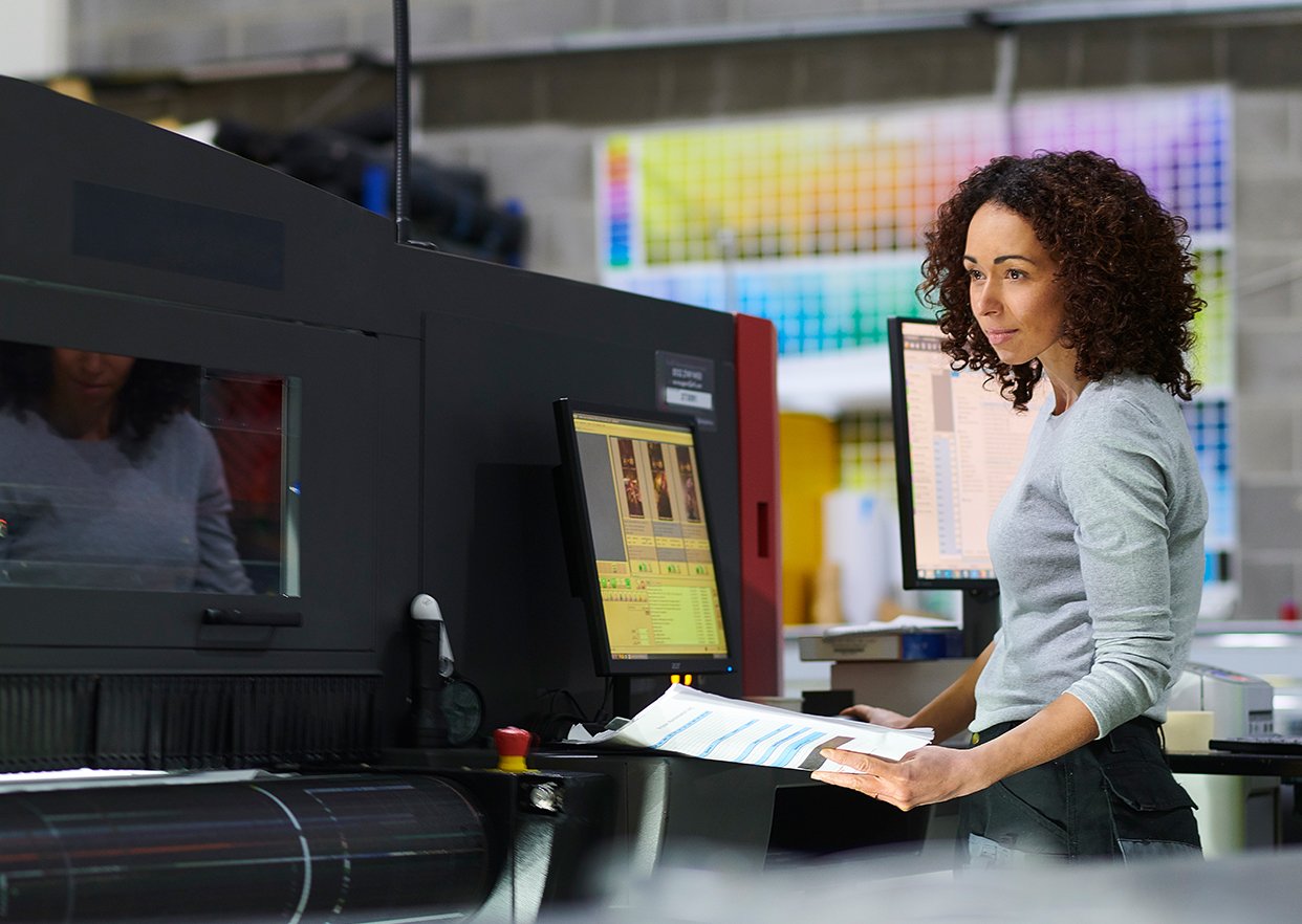 Woman working the hybrid flexo press