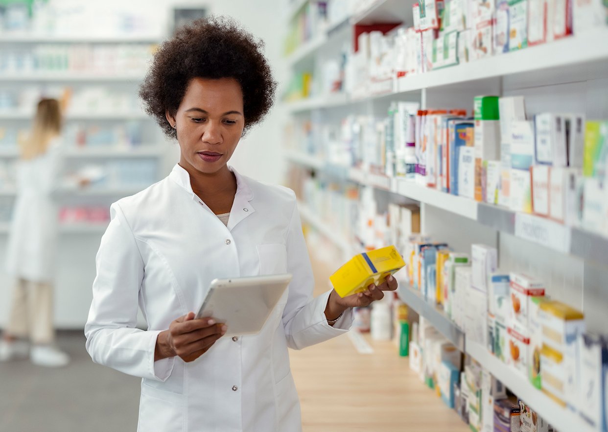 A pharmacist processing a cold chain delivery