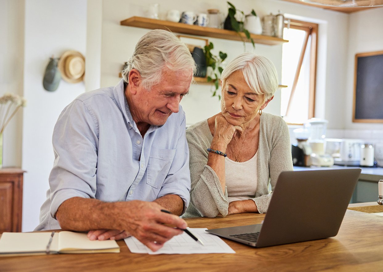 A man and woman going through their tax forms