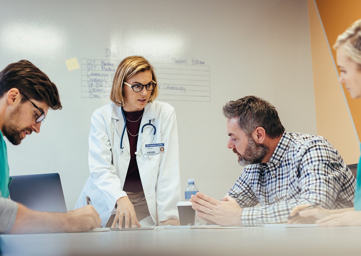 A group of healthcare workers assessing a downtime situation