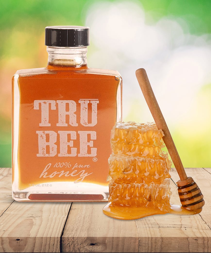 Branded shrink sleeve jar containing honey