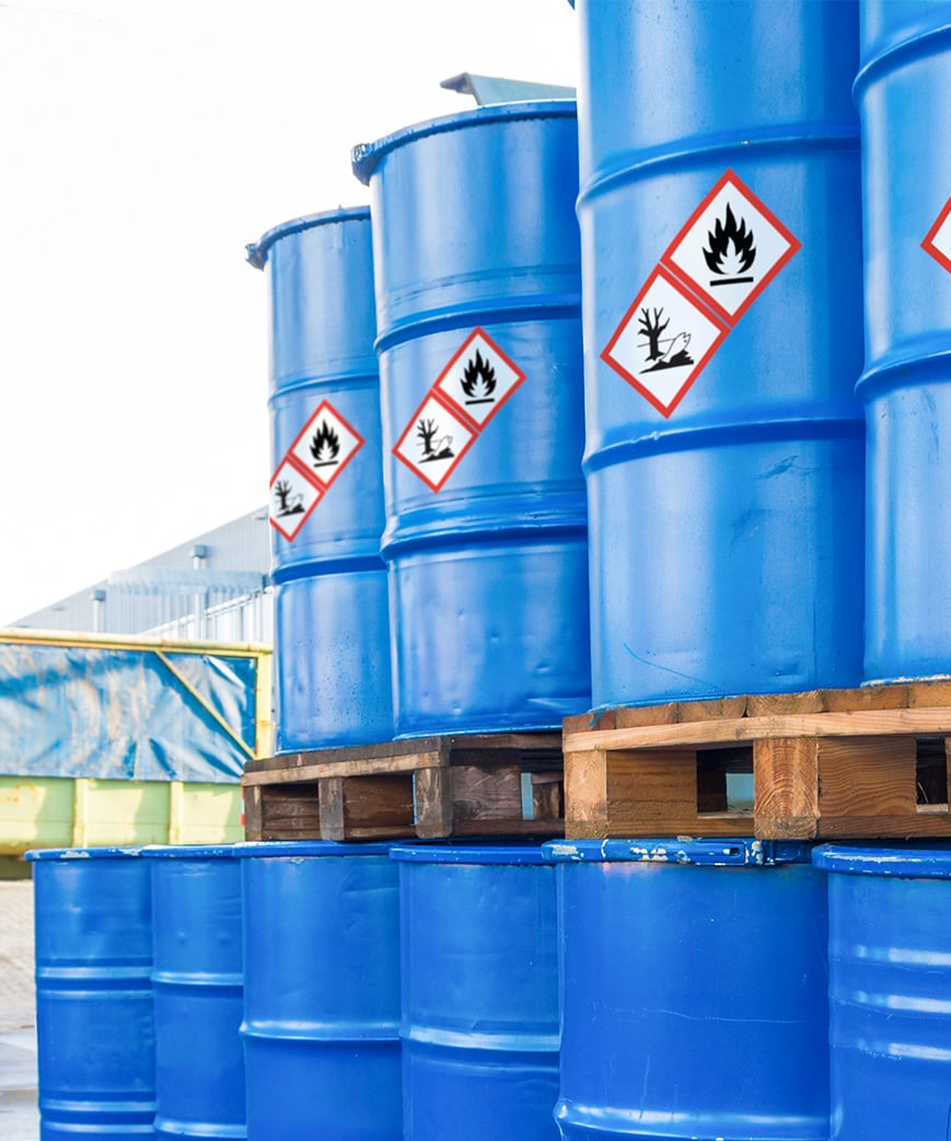 Cans of hazardous materials clearly marked with durable warning labels to comply with the Hazard Communication Standard 